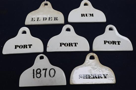Seven 19th century creamware pyriform bin labels, arched suspension holes